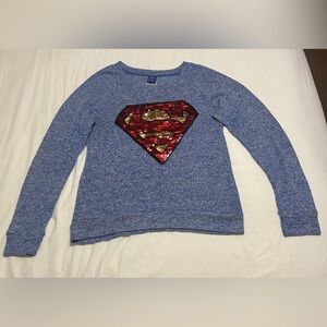 DC Comics Superman women’s blue sweater with red and gold sequin patch. Size XL.